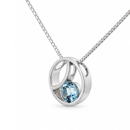 A side view of a sterling silver blue topaz pendant hanging on a sterling silver box chain