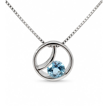 A blue topaz circle sterling silver pendant hanging on a sterling silver box chain. 