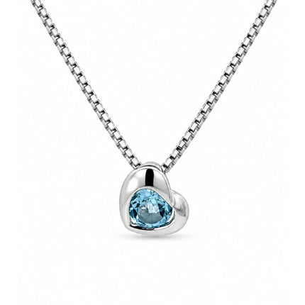 A silver heart pendant necklace featuring a faceted light blue gemstone, suspended from a silver box chain against a solid white background.