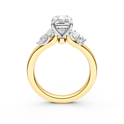 A profile view of a diamond accent engagement ring in yellow gold 