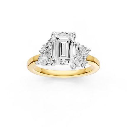A top view of an emerald cut floral inspired diamond engagement ring in yellow gold 