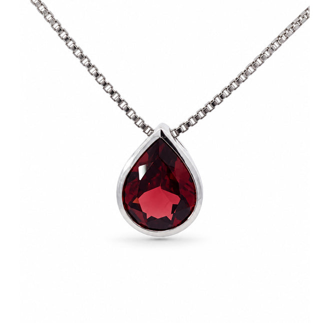 A pear shape Mozambique garnet set in a bezel in sterling silver with a sterling silver chain. 