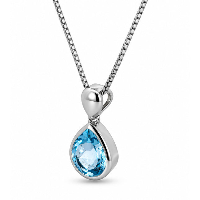 An angled tear drop blue topaz pendant on a sterling silver chain. 