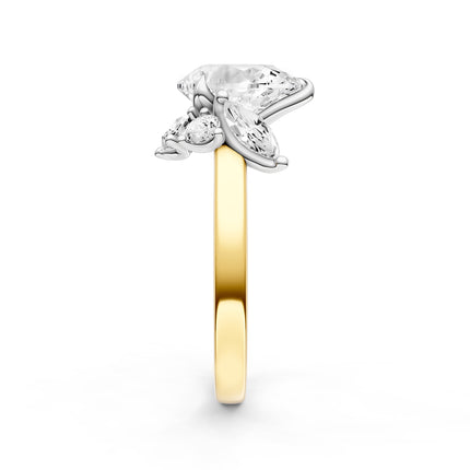 A side view of a yellow gold diamond accent engagement ring.