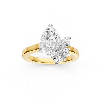 A top view of a pear shaped floral diamond engagement ring in yellow gold. 