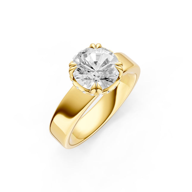 Yellow gold ring with a round diamond in the center and a hidden halo under the center stone