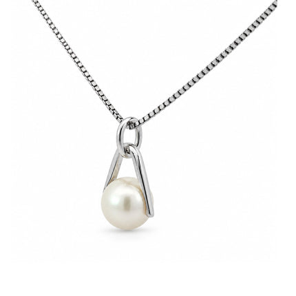 A side view of a freshwater pearl pendant in sterling silver hanging on a sterling silver chain. 