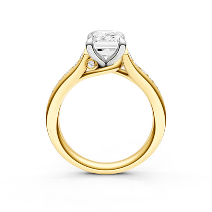 A side profile of a two-tone gold diamond engagement ring. 
