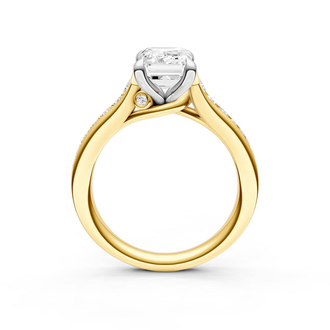 A side profile of a two-tone gold diamond engagement ring. 