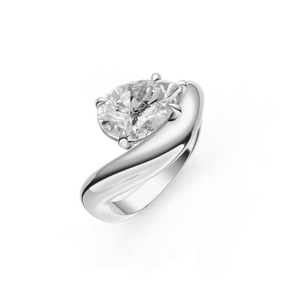 A white gold curved pear shape diamond solitaire diamond engagement ring. 