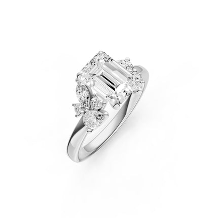 A white gold, emerald cut, floral inspired diamond engagement ring. 