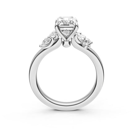 A profile view of a white gold, diamond accent engagement ring. 