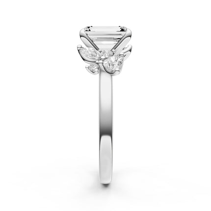 A side view of a white gold, diamond accent engagement ring. 