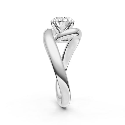 A side view of a white gold, diamond engagement ring. 