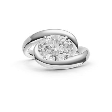 A white gold, oval cut, bypass, east-to-west diamond engagement ring top view. 