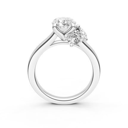 A profile view of a white gold diamond accent engagement ring. 