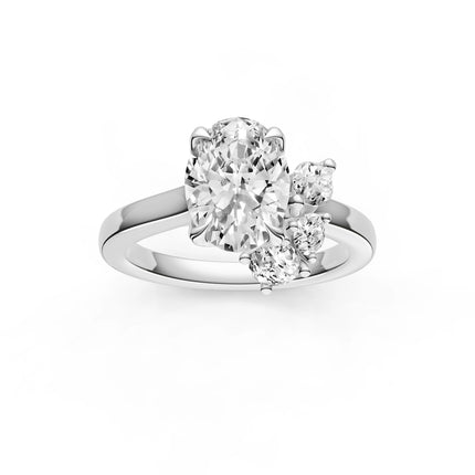 A top view of a white gold, oval cut floral inspired diamond engagement ring. 