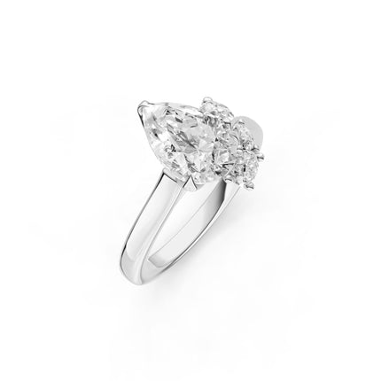 A white gold, pear shape, floral diamond engagement ring. 