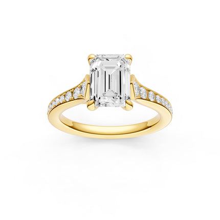 A top view of a yellow gold emerald cut diamond accent engagement ring. 